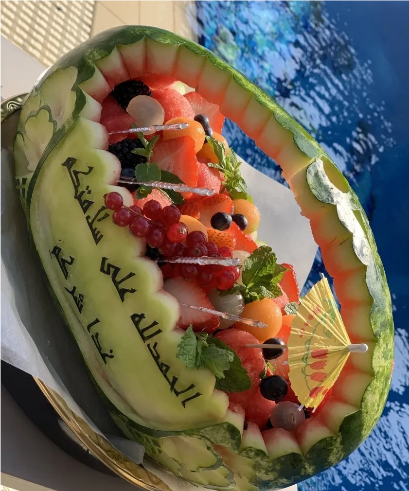 Carved Watermelon basket with mix berries and strawberries