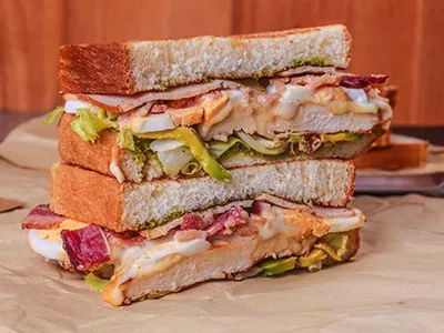 Grilled Chicken With Egg, Bacon, Turkey, Swiss Cheese And Special Sauce. 