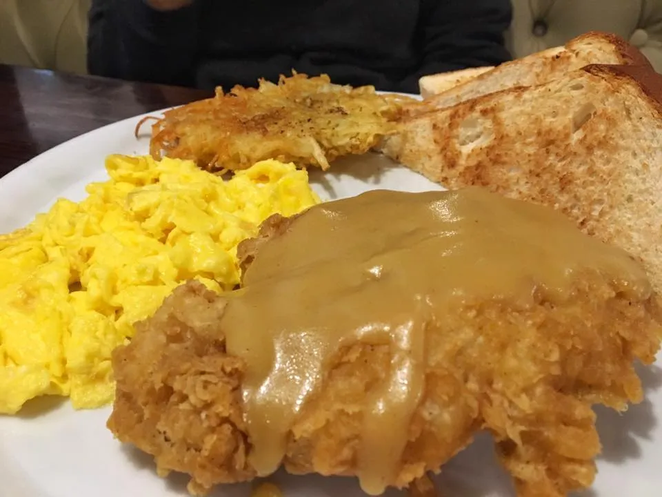 Chicken fried steak (chicken) and eggs.