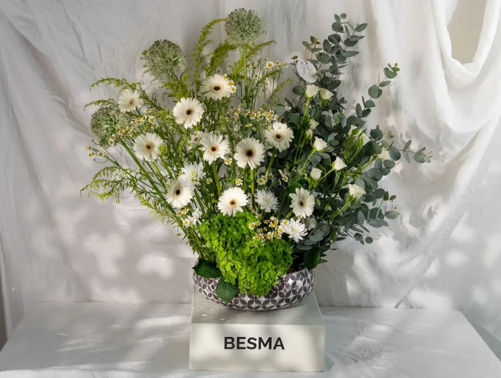 White Gerbera stand arrangement