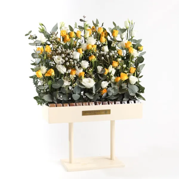 Wooden stand with assortment of yellow flowers and chocolate 28 pieces L45