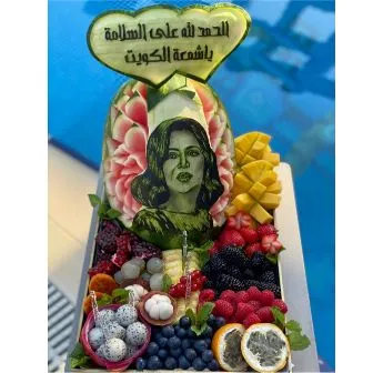 Carved personal picture or logo with mix fruit of our choice