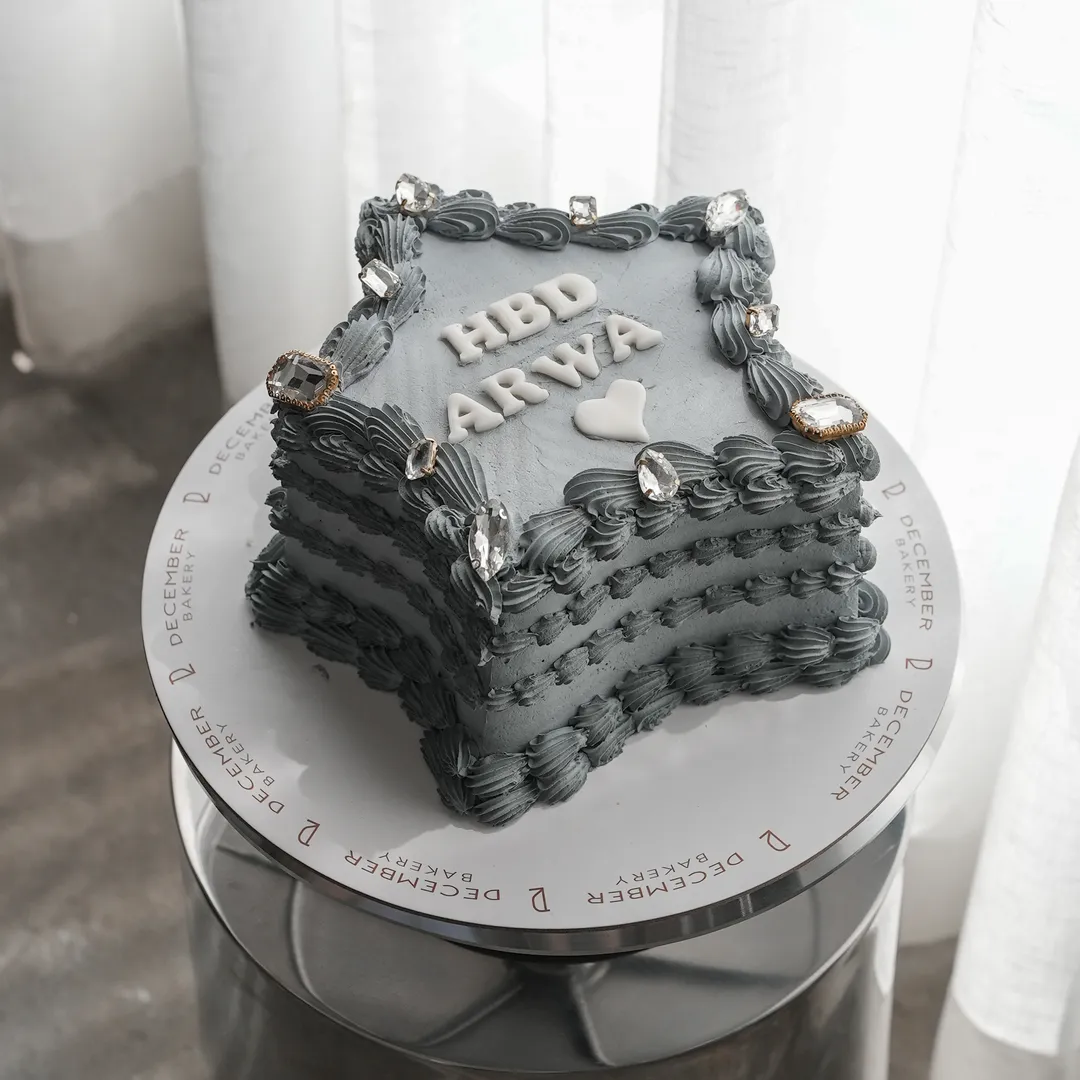 6-inch grey star-shaped cake decorated with crystals