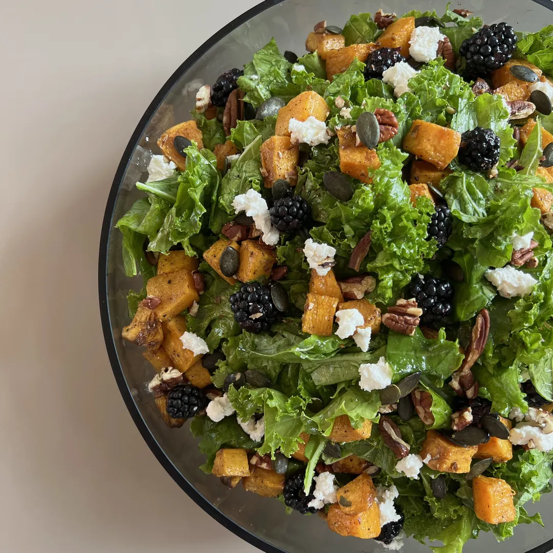 kale butternut squash salad with blueberries and roasted pecans