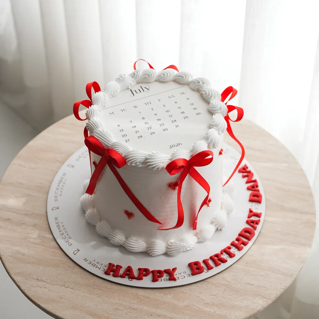 Calendar and Red Ribbon Cake