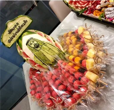 Carved personal picture or logo with covered fruit sticks