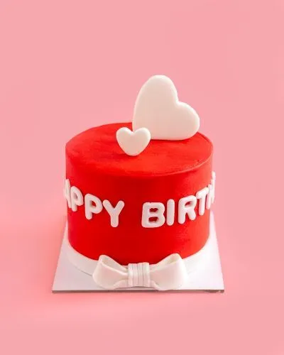 White ribbon love cake