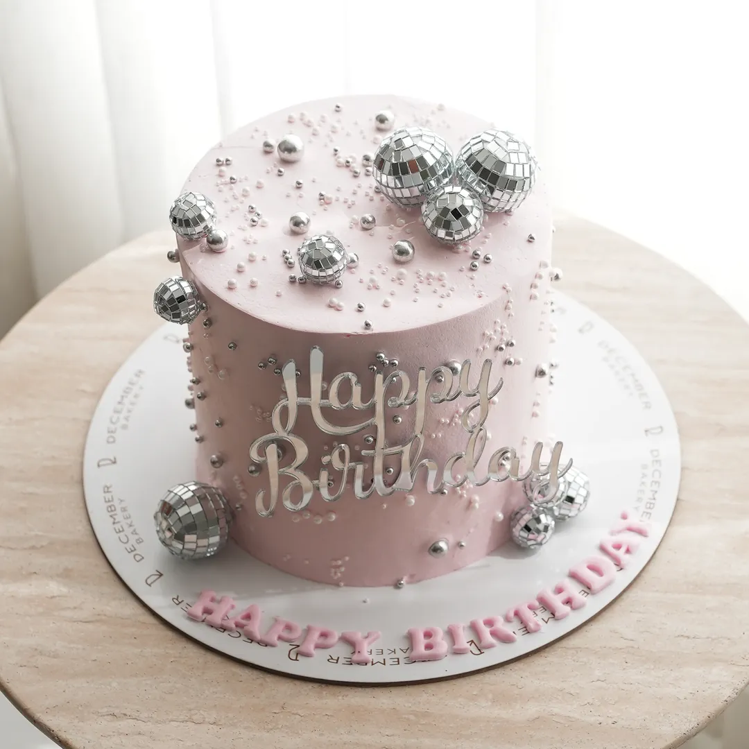 Pink Pink cream cake with disco balls