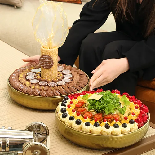 A tray of chocolates with a mix of golden-colored MIX Fatayer (decoration mb)