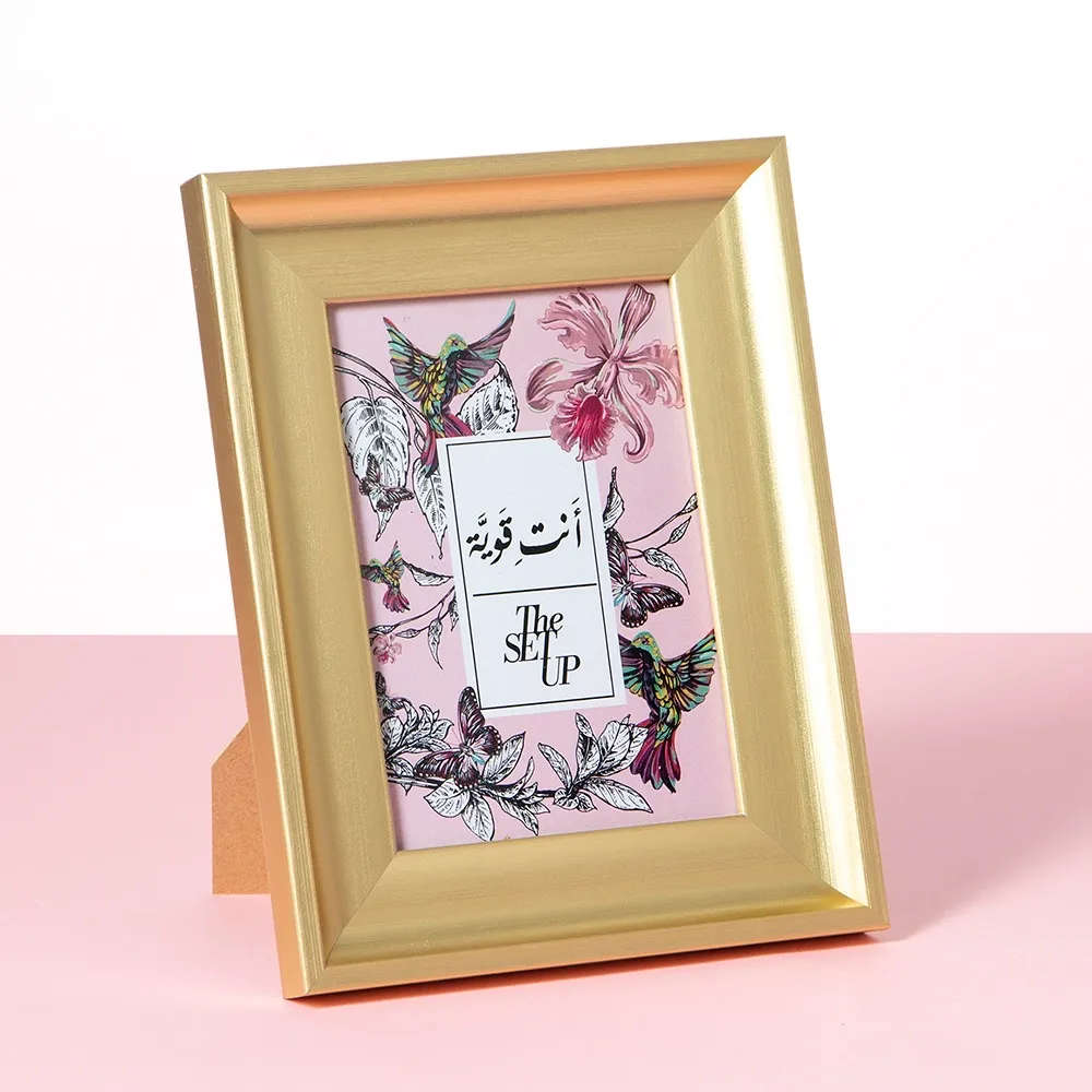برواز ذهبي جديد "انت قوية"